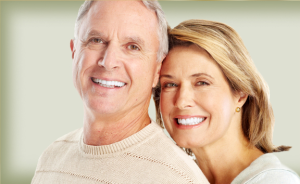 A man and woman smile for the camera.