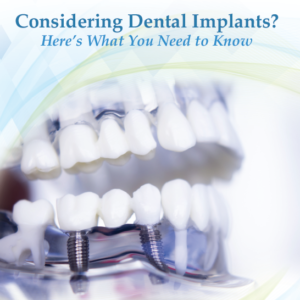 A picture of an implant model with teeth and implants.